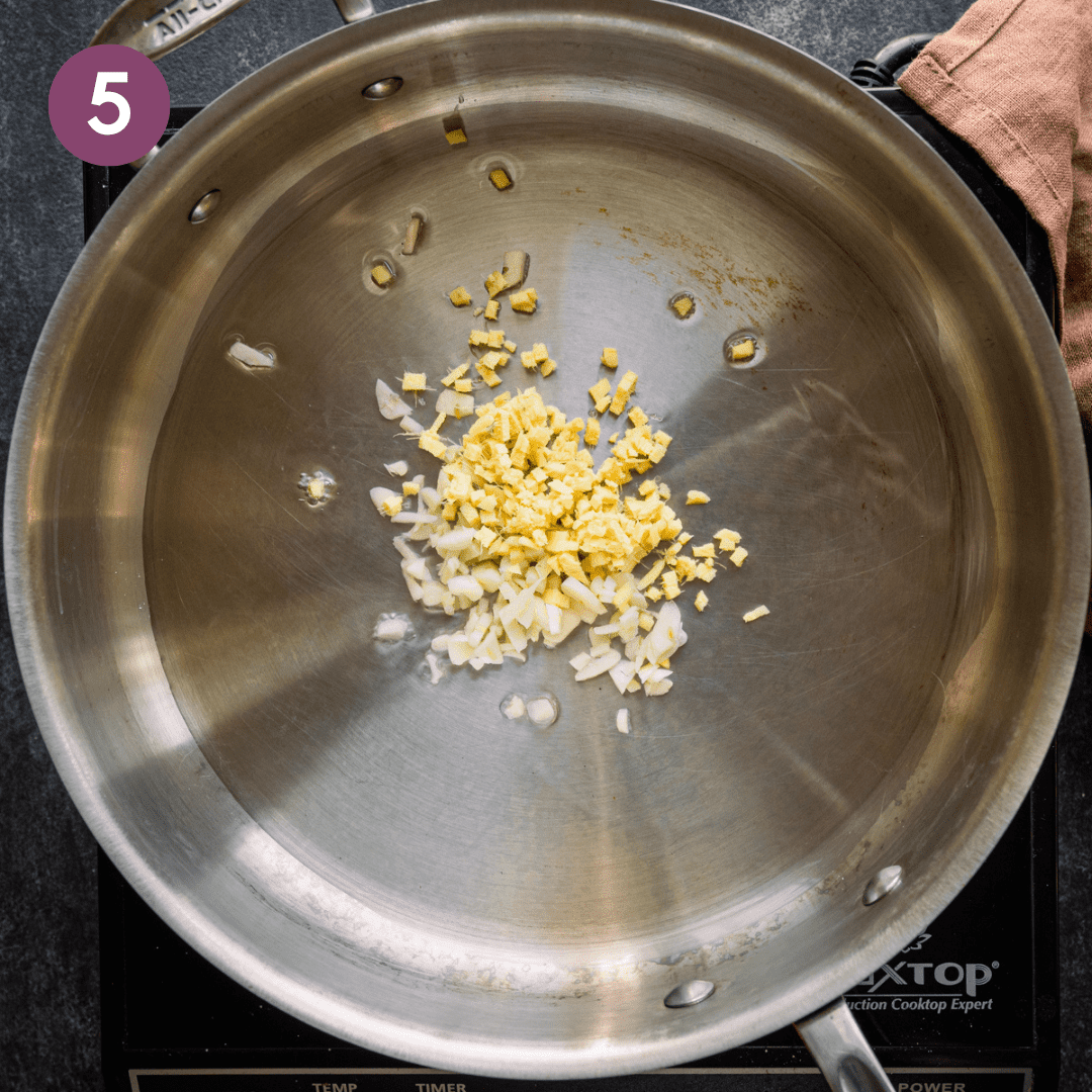 Garlic and ginger with oil in large frying pan.