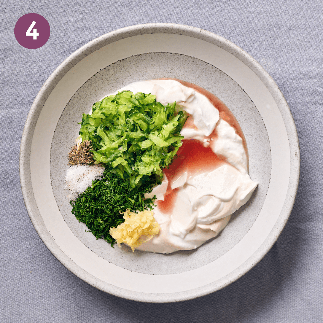 Tzatziki ingredients in a bowl before being mixed.