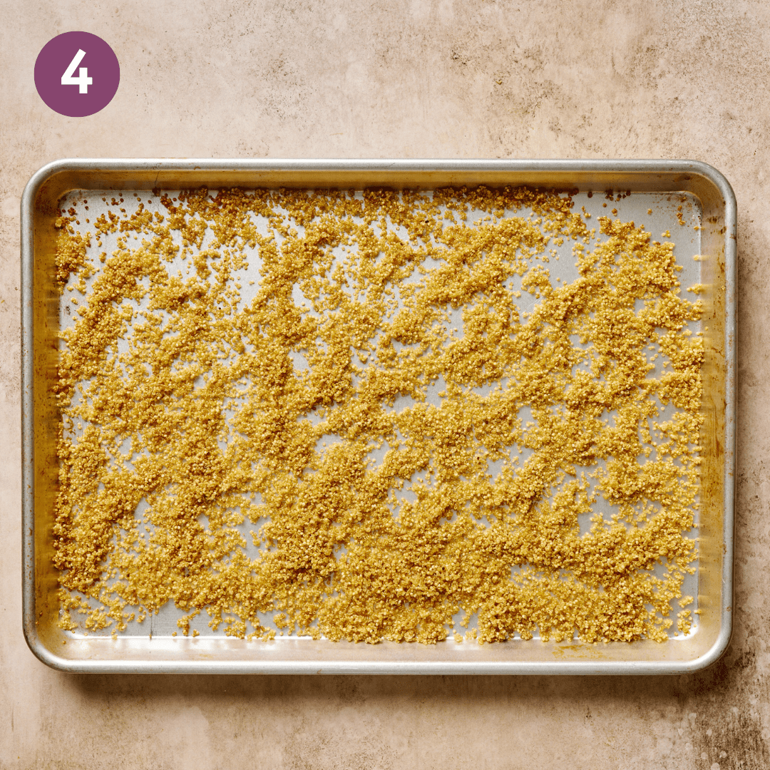 Roasted quinoa on a baking sheet.