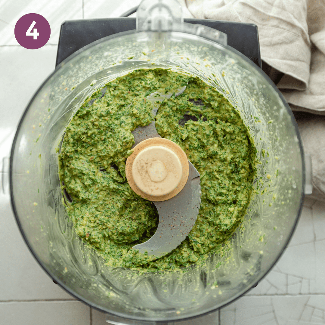 Pasty textured pesto in the food processor before olive oil is added.