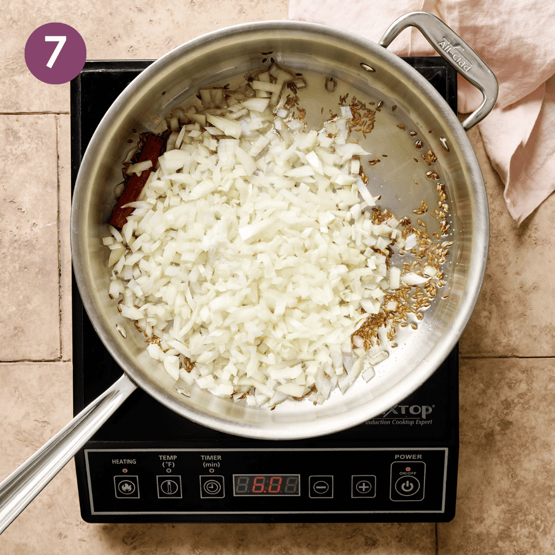 Chopped onion and a bit of salt added to the saute pan.