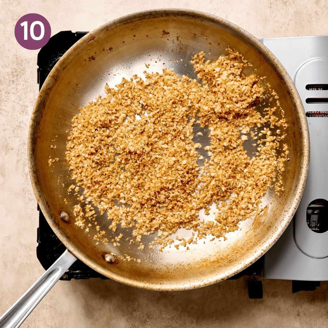 Golden brown toasted breadcrumbs in a skillet.
