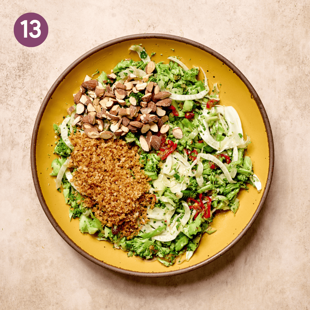 Panko bread crumbs and nuts added to the dressed broccoli salad.