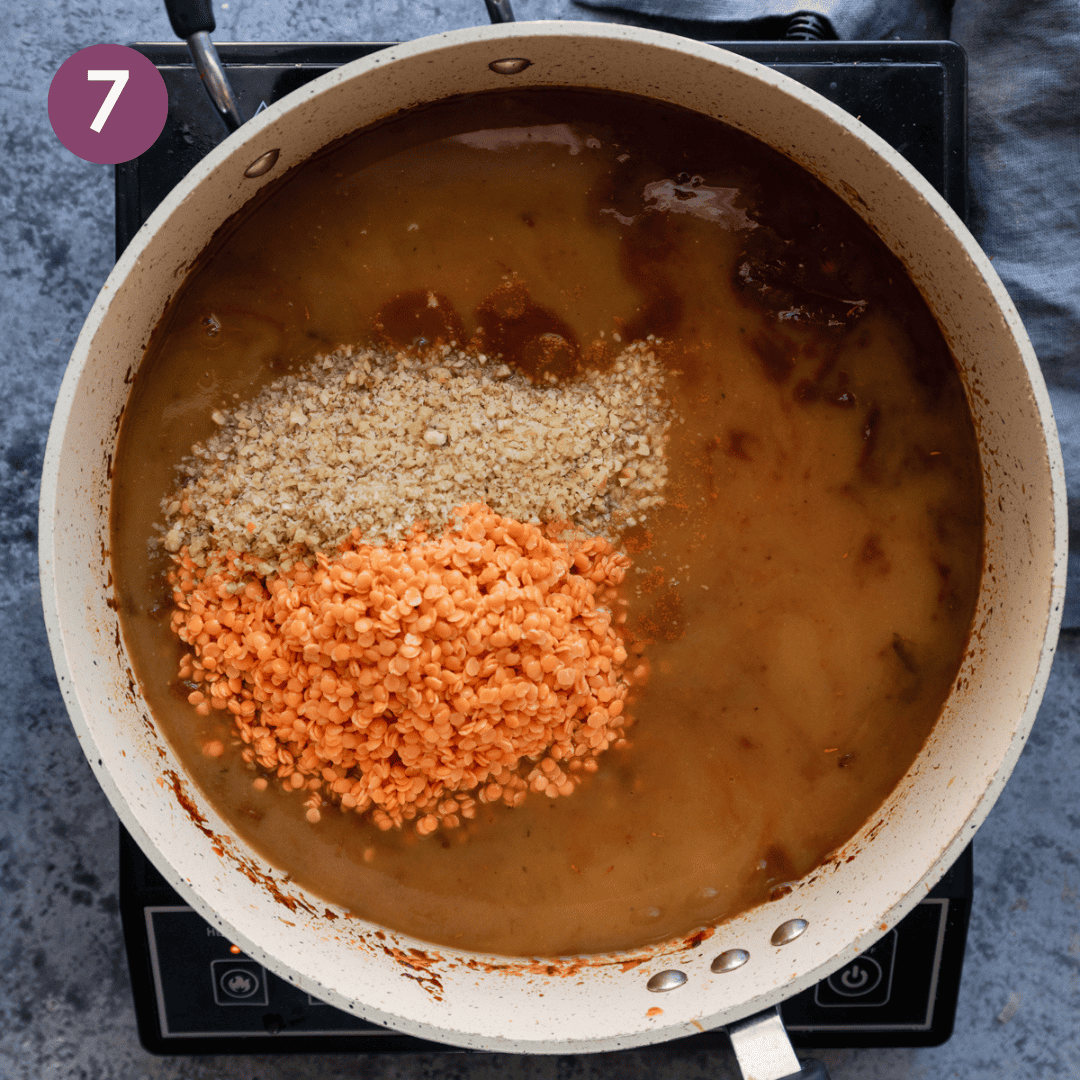 Walnuts, lentils and vegetable broth added to onion mixture.