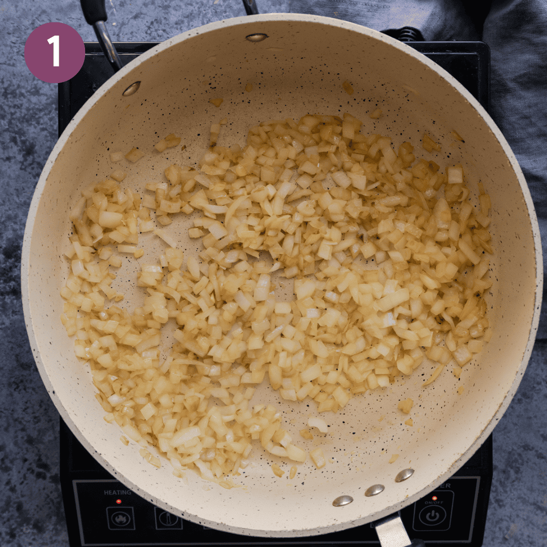 Onions sauteing in a pan.