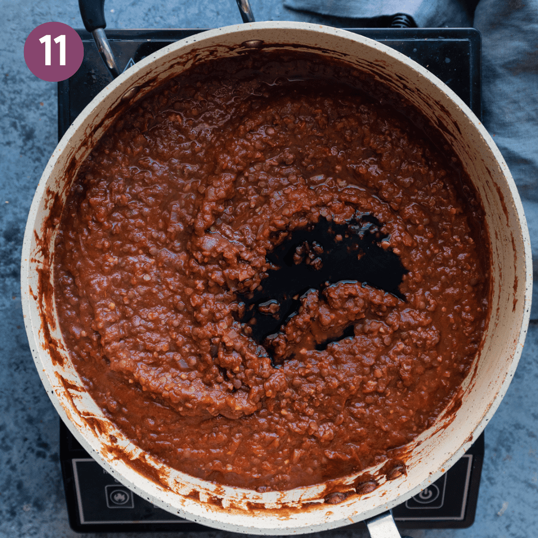 Balsamic vinegar added to bolognese in the pan.