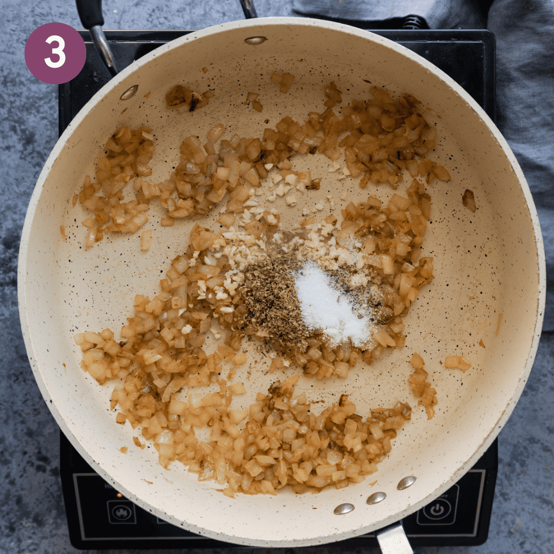 garlic, herbs, salt and pepper added to the pan.