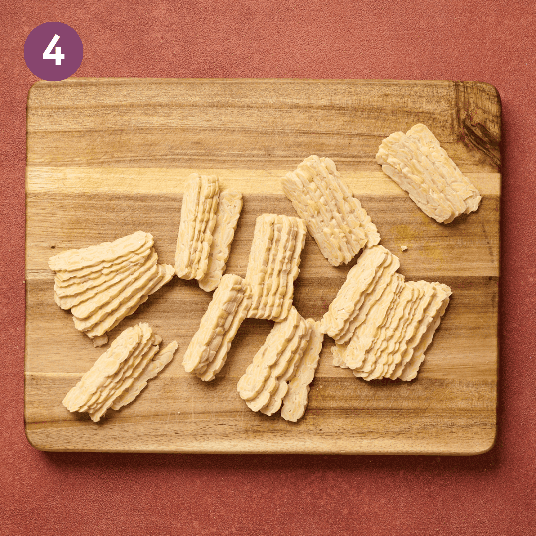 Sliced tempeh strips on the cutting board.