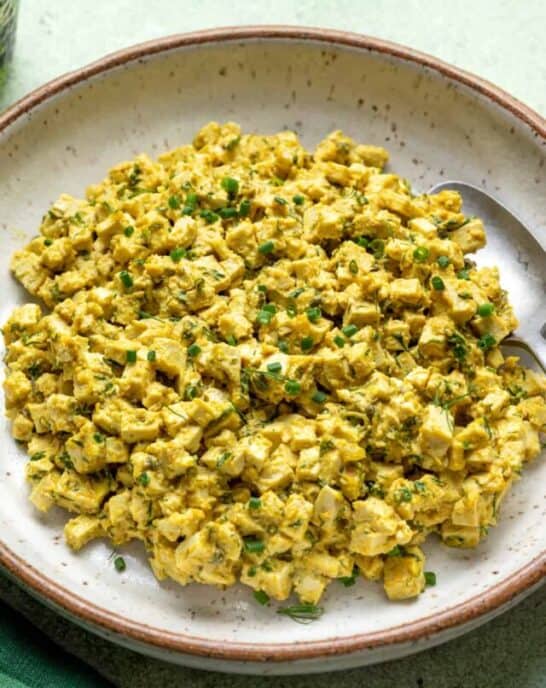 Vegan egg salad in a large white bowl.