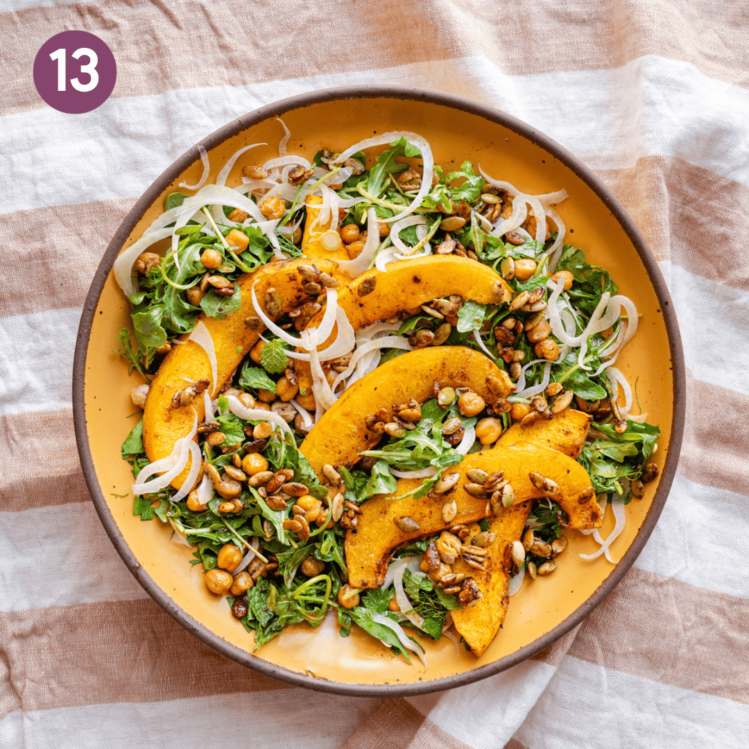 Sliced fennel, roasted chickpeas and pumpkin, and pumpkin crunch added to the bowl of greens.