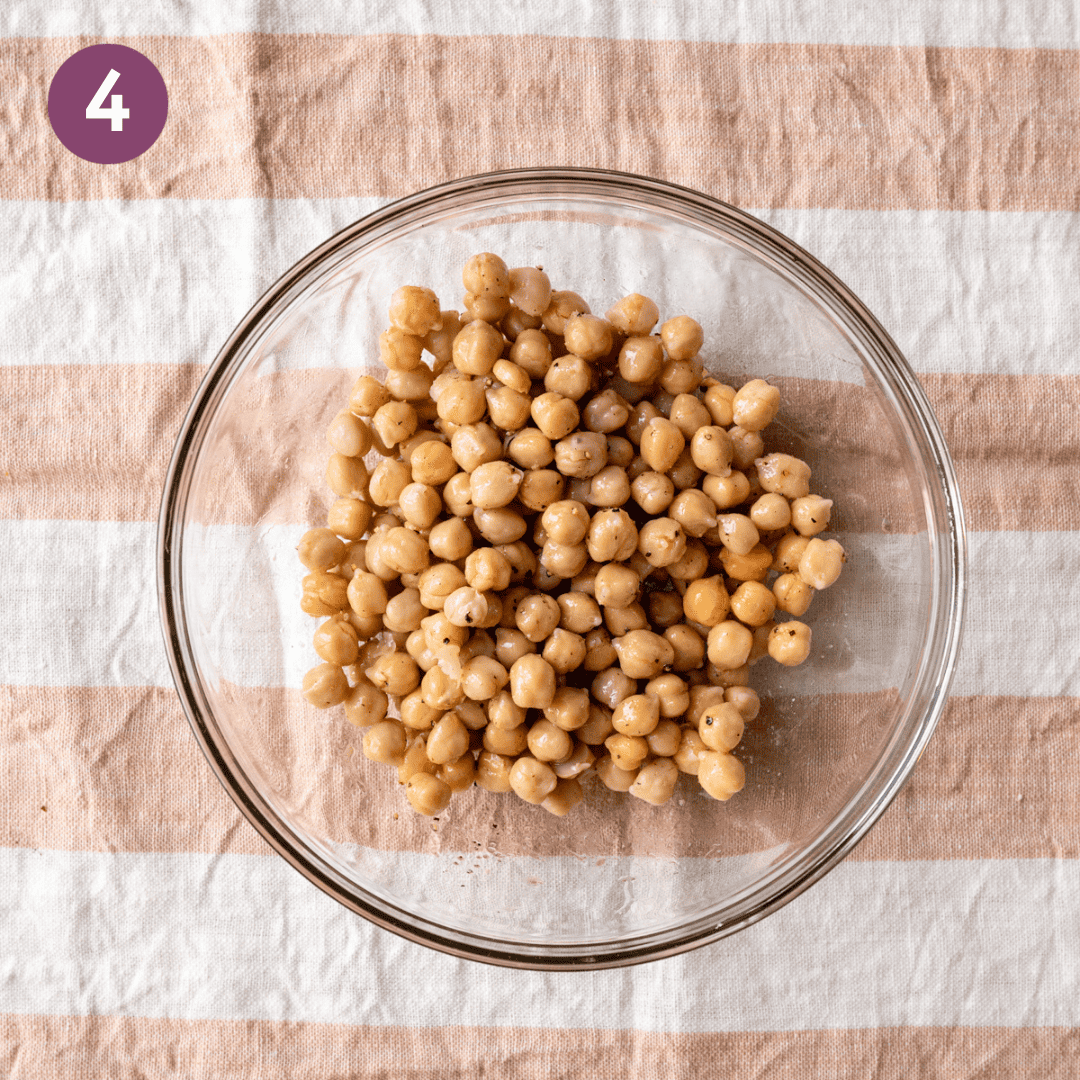 Seasoned chickpeas in a glass bowl.