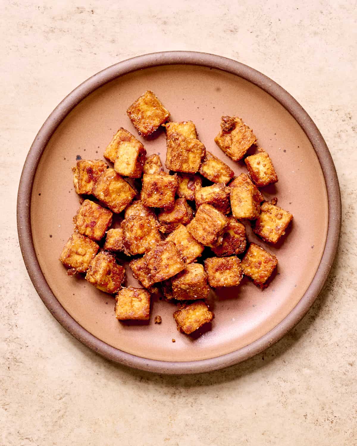 Five Spice fried tofu on a plate.