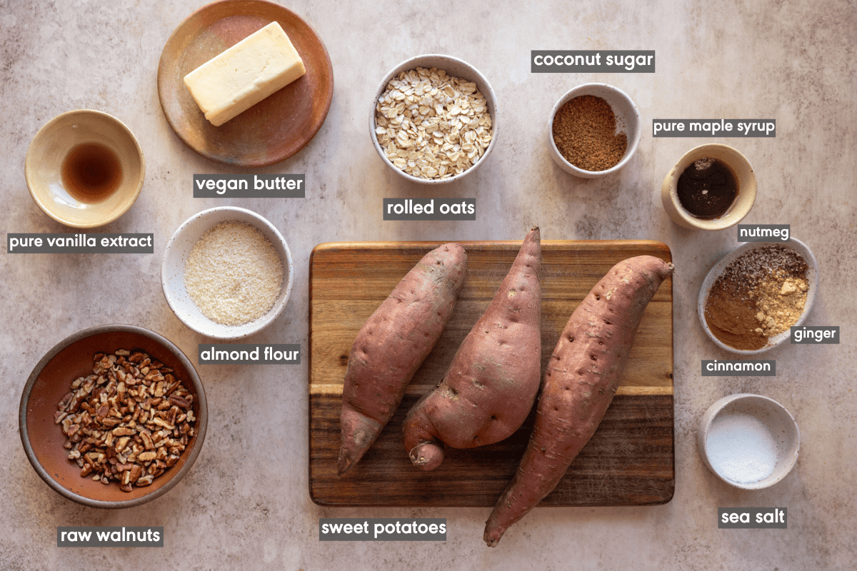 Sweet potato casserole ingredients in various bowls on a table.