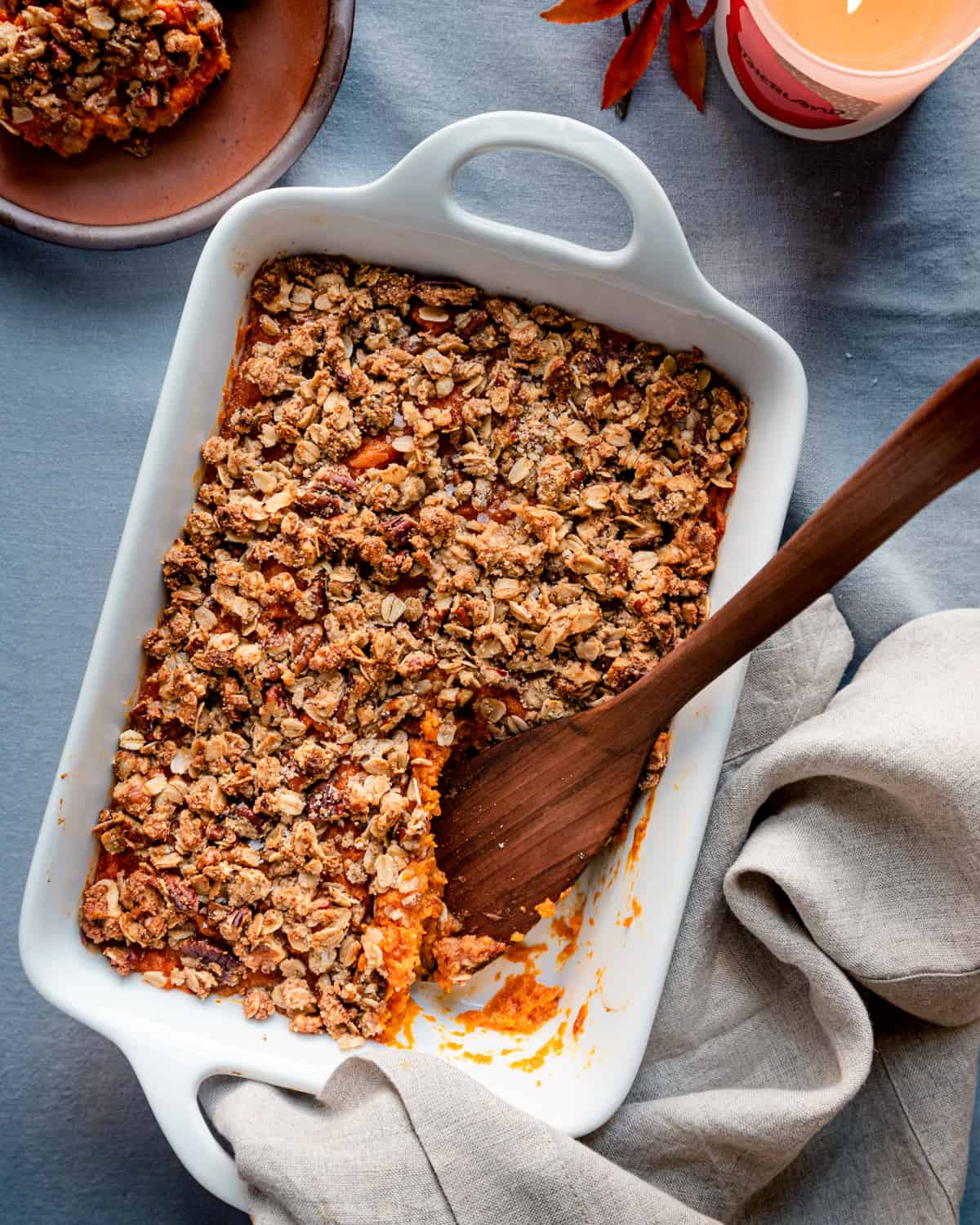 One slice taken from casserole in a baking dish.