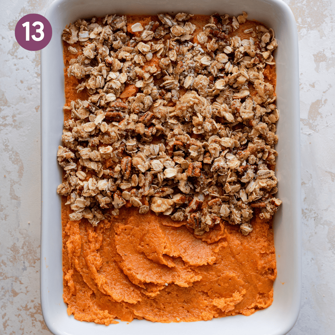 Crumble topping added to half of the mashed sweet potato in the casserole dish.