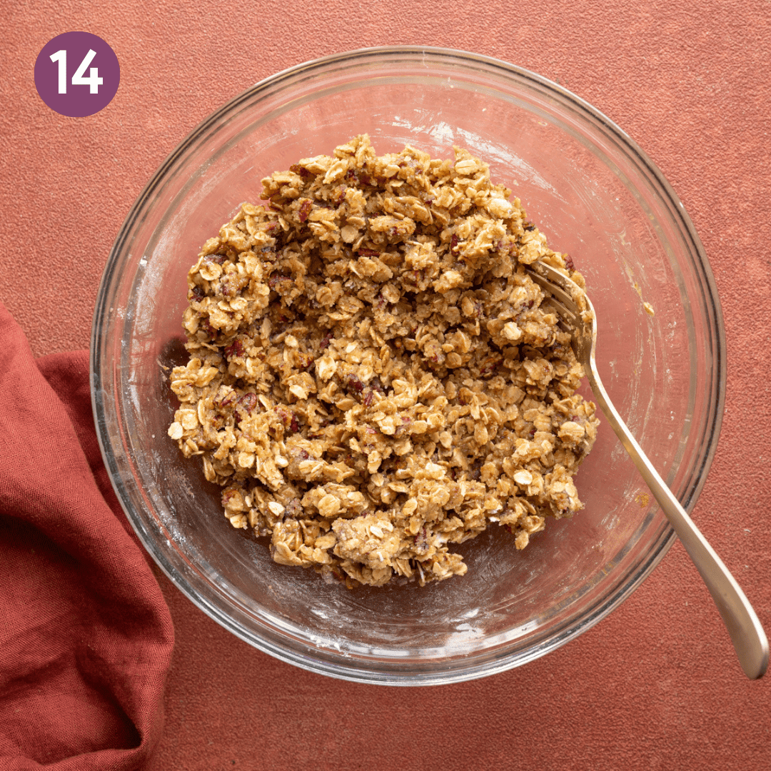 Mixed apple crisp topping in a glass bowl.