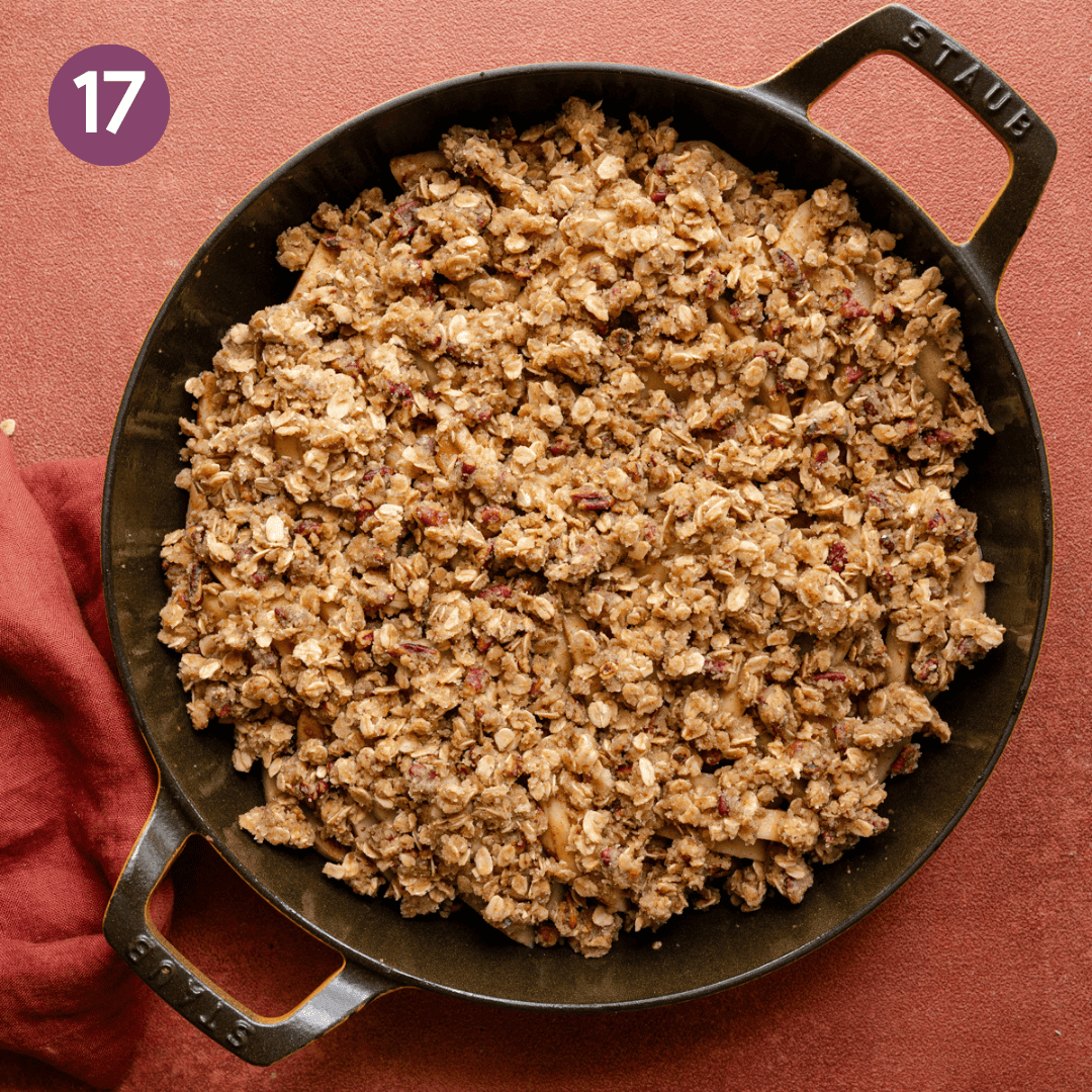 Apple crisp in skillet before being baked.