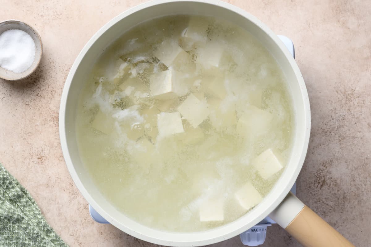 tofu cubes in a pot of boiling water.