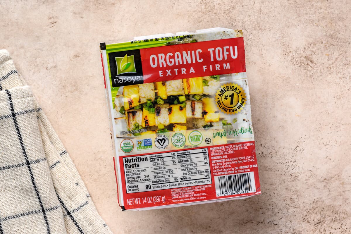 extra firm tofu package on a table.