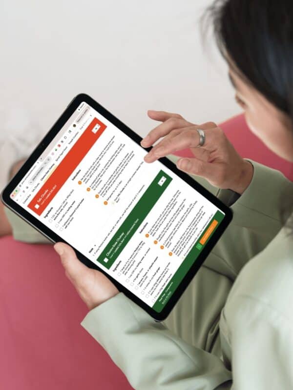 woman using meal plans by rainbow plant life website on her tablet.