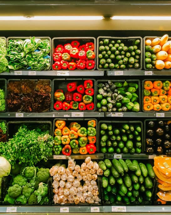Grocery store refrigerated vegetables in produce section.