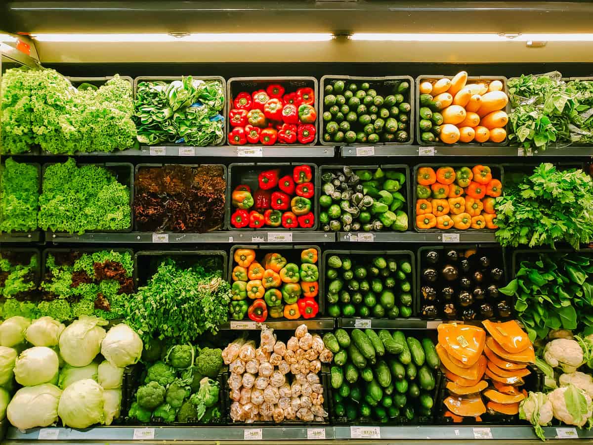 Grocery store refrigerated vegetables in produce section.