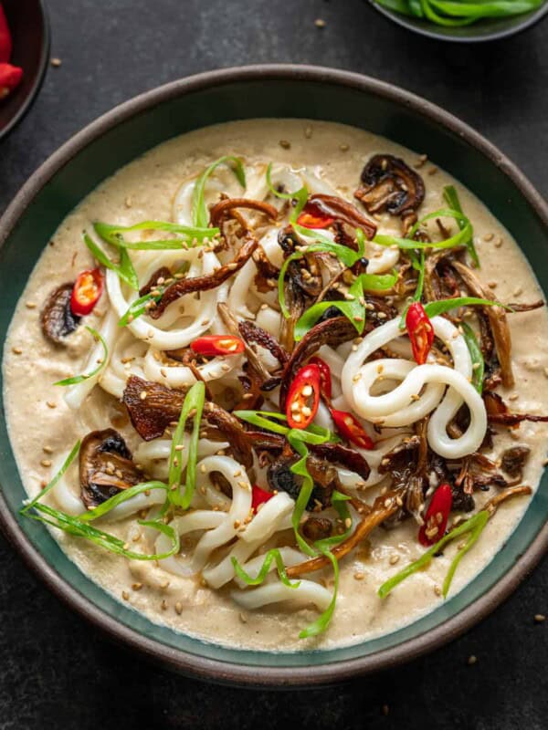 umami noodle soup in a bowl on a table.