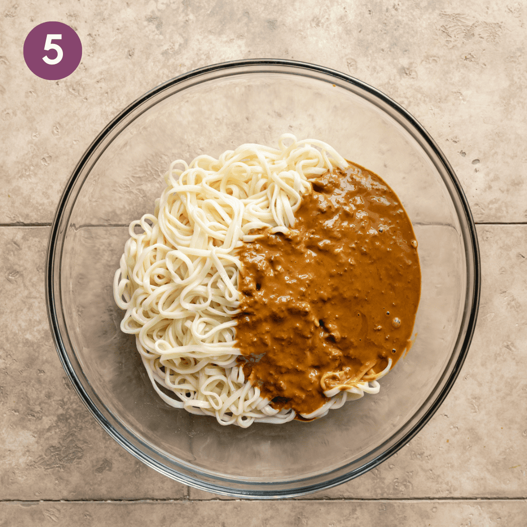 sauce and noodles in a glass bowl.