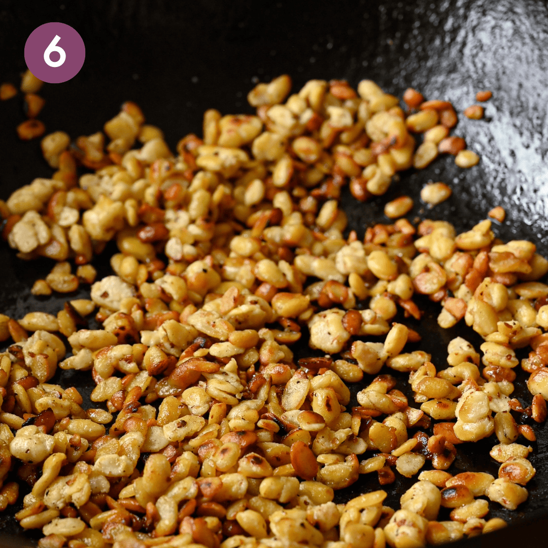 golden brown and crisp tempeh crumbles in pan.