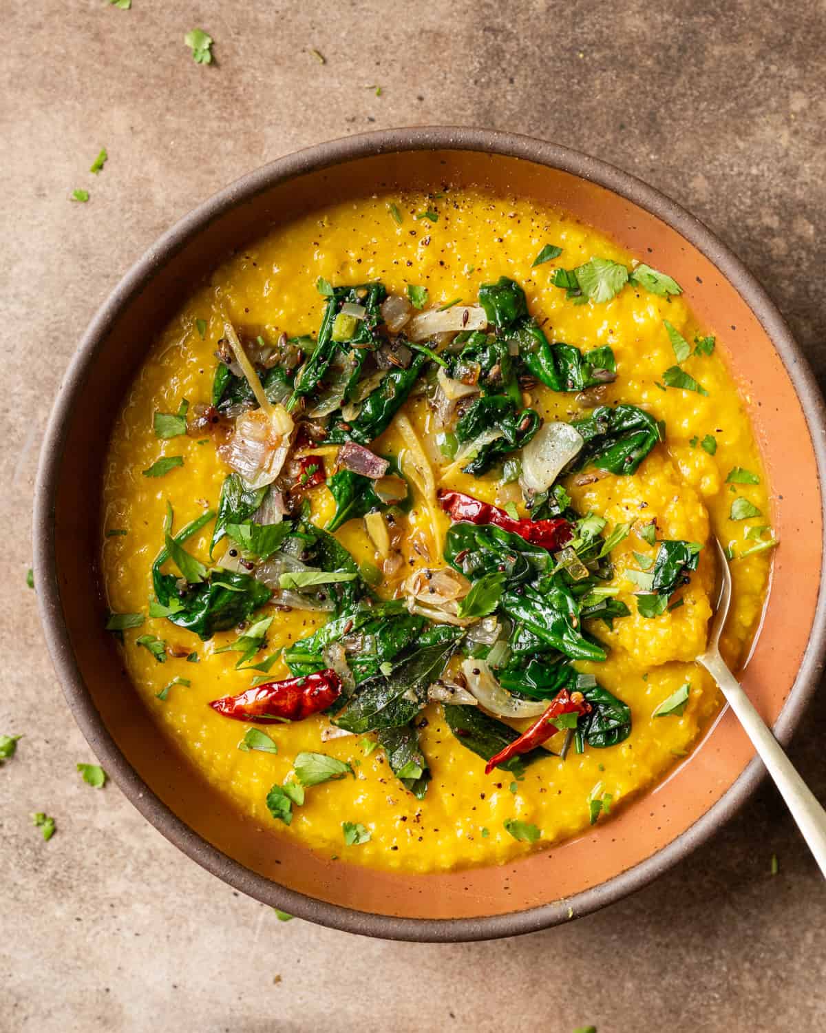 Dal palak in bowl on a table.