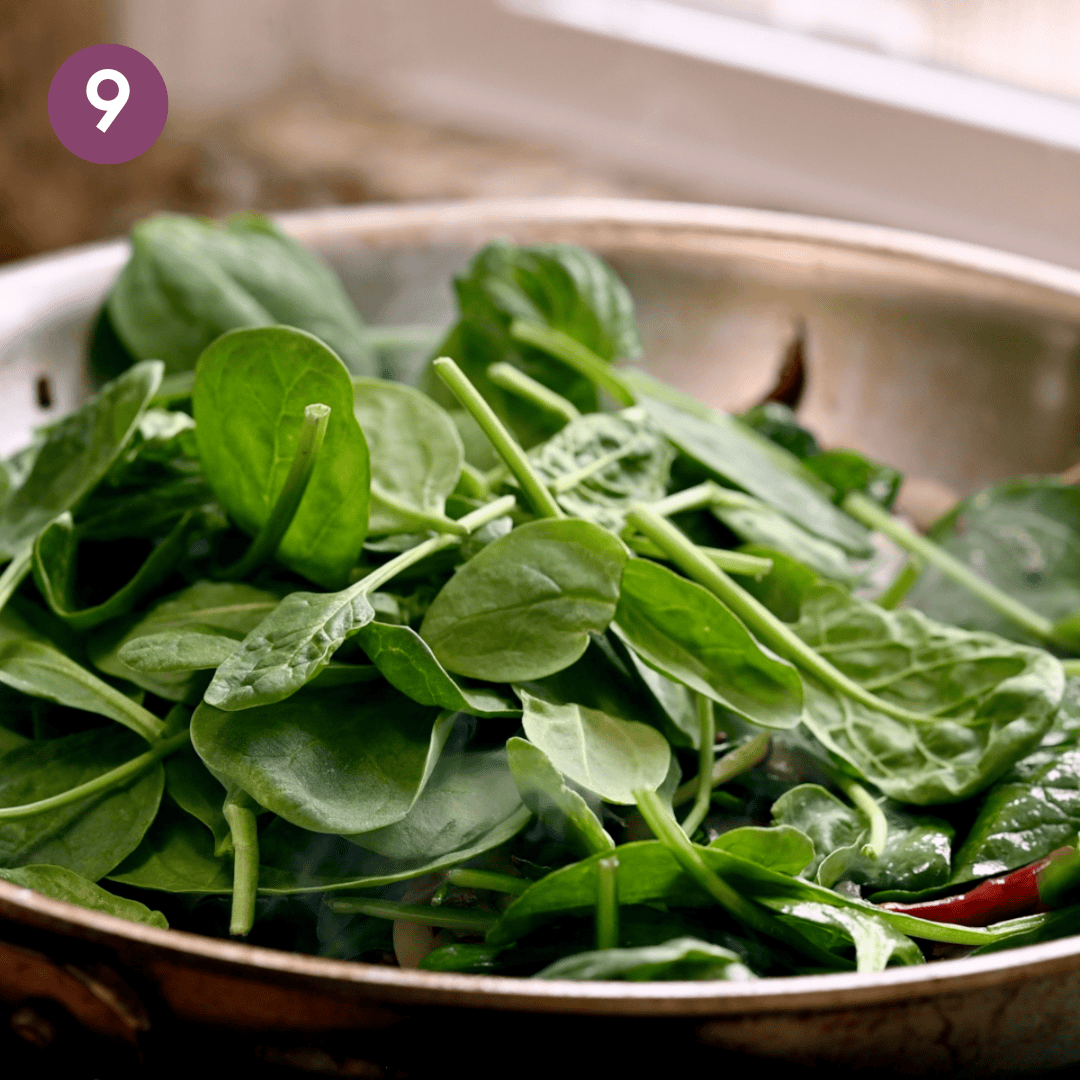 baby spinach added to saucepan.
