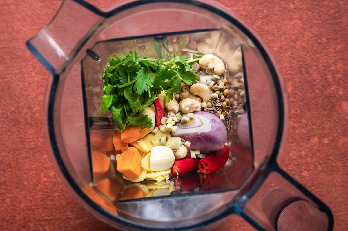 Ingredients for homemade Malaysian laksa curry paste arranged in a blender. 