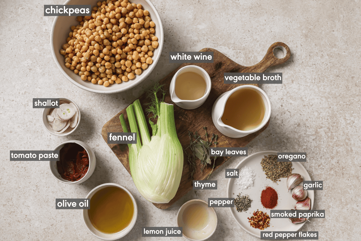 ingredients for braised chickpeas in various bowls on a table.
