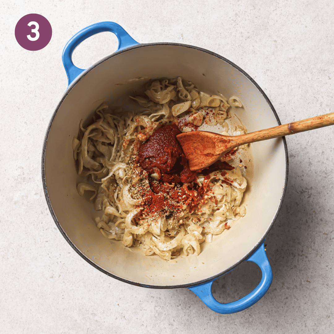 tomato paste, oregano, red pepper flakes, and paprika added to the pot. 