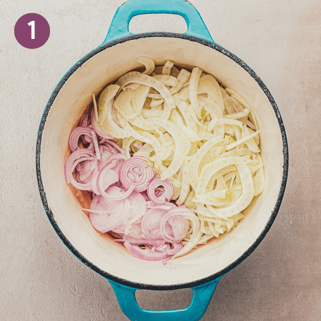 raw fennel and shallot in a dutch oven.