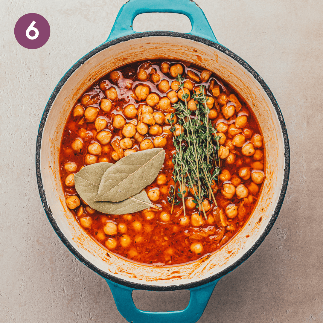 chickpeas, bay leaves and thyme sprigs added to dutch oven.