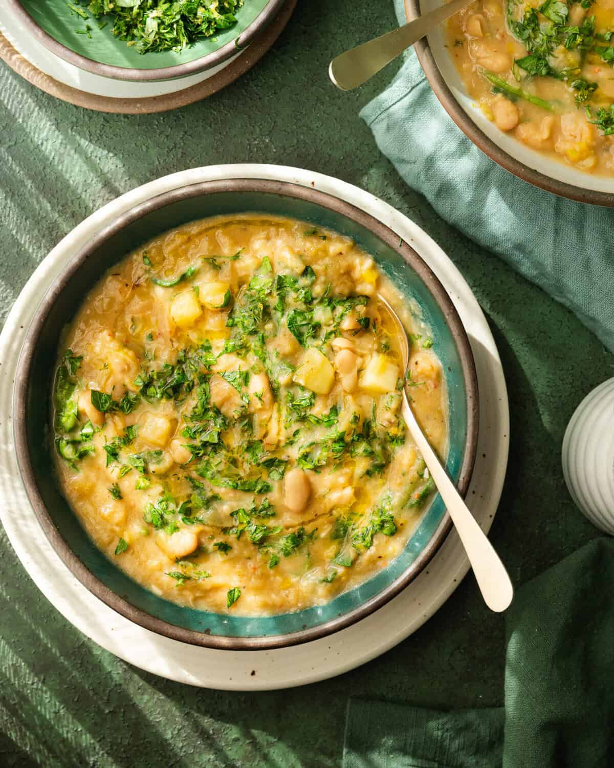 Bowls of potato leek soup on a table.