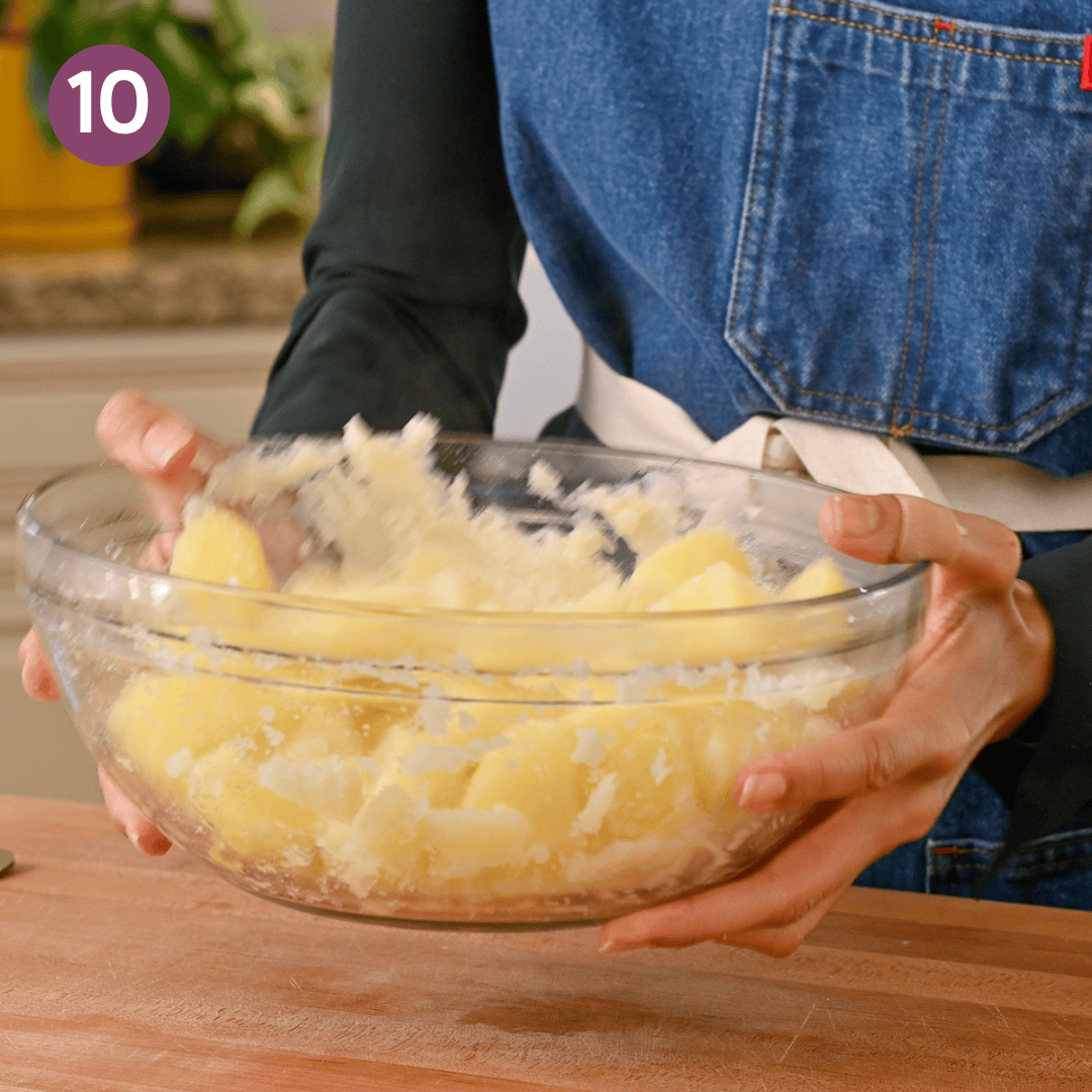 person shaking the potatoes in the bowl for a minute.