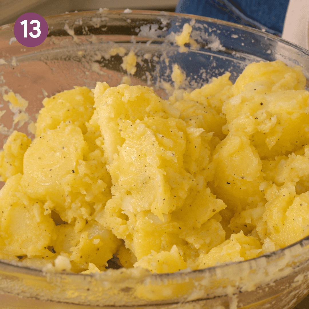 starchy tossed potatoes that are covered in oil, salt and pepper in bowl.