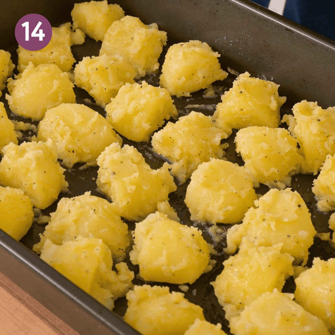 potatoes evenly spaced in preheating roasting pan.