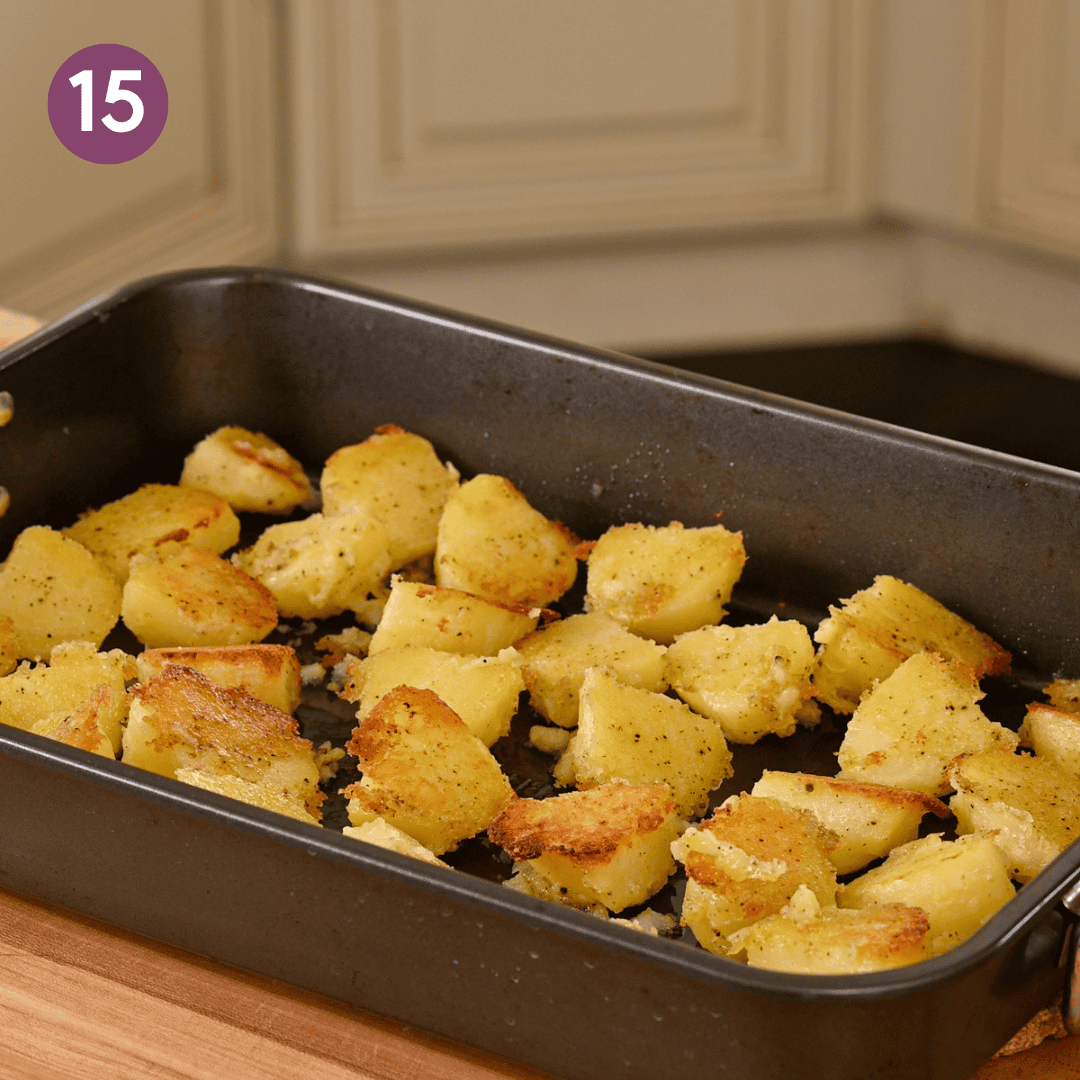 half roasted potatoes in the pan after they've been flipped.