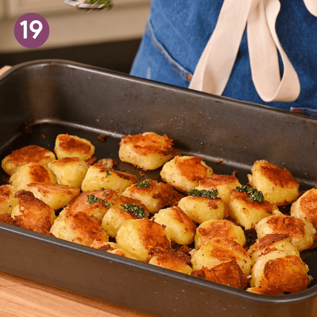 crispy roasted potatoes with chunks of rosemary oil on them.