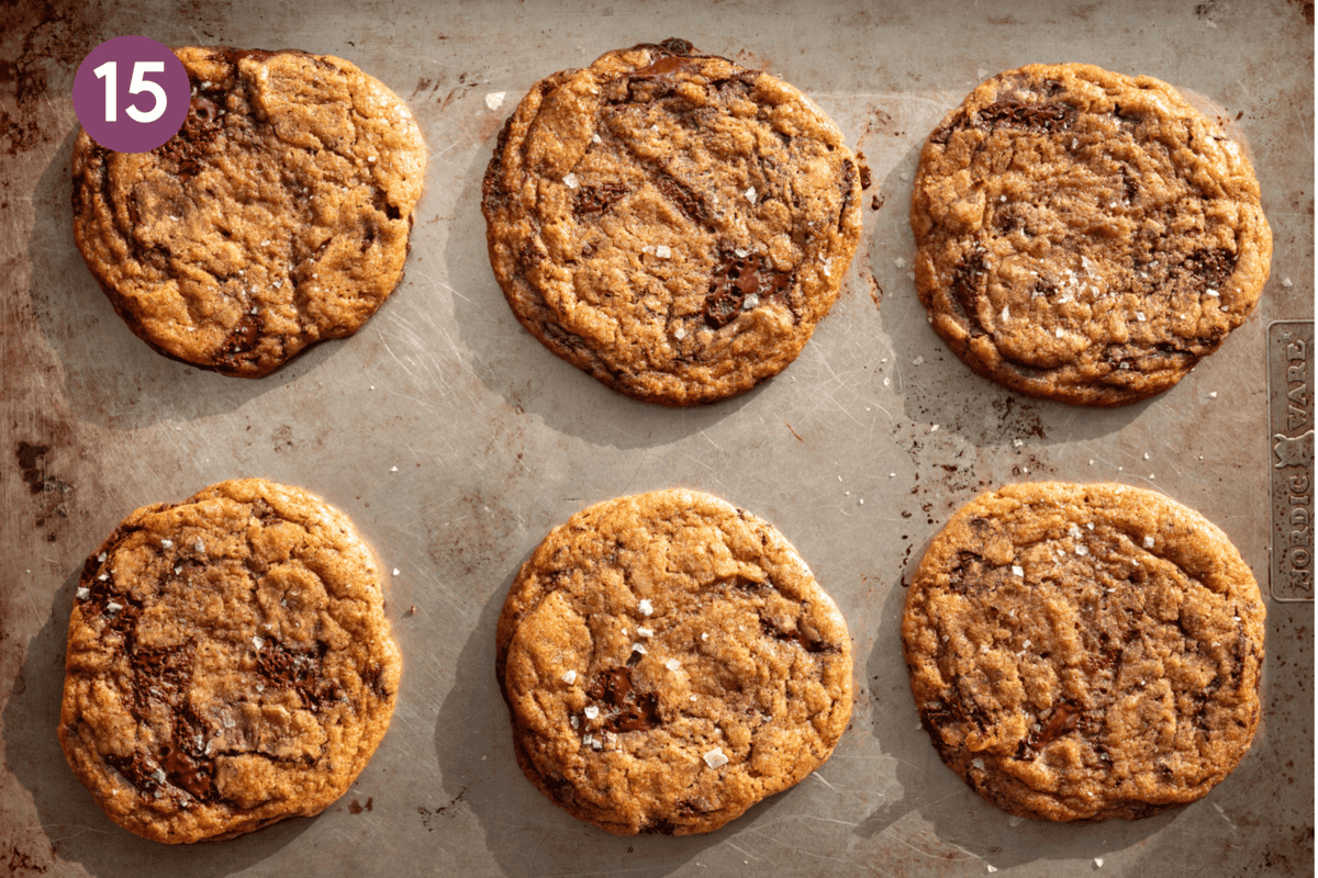 baked cookies sprinkled with flaky sea salt on a baking tray.