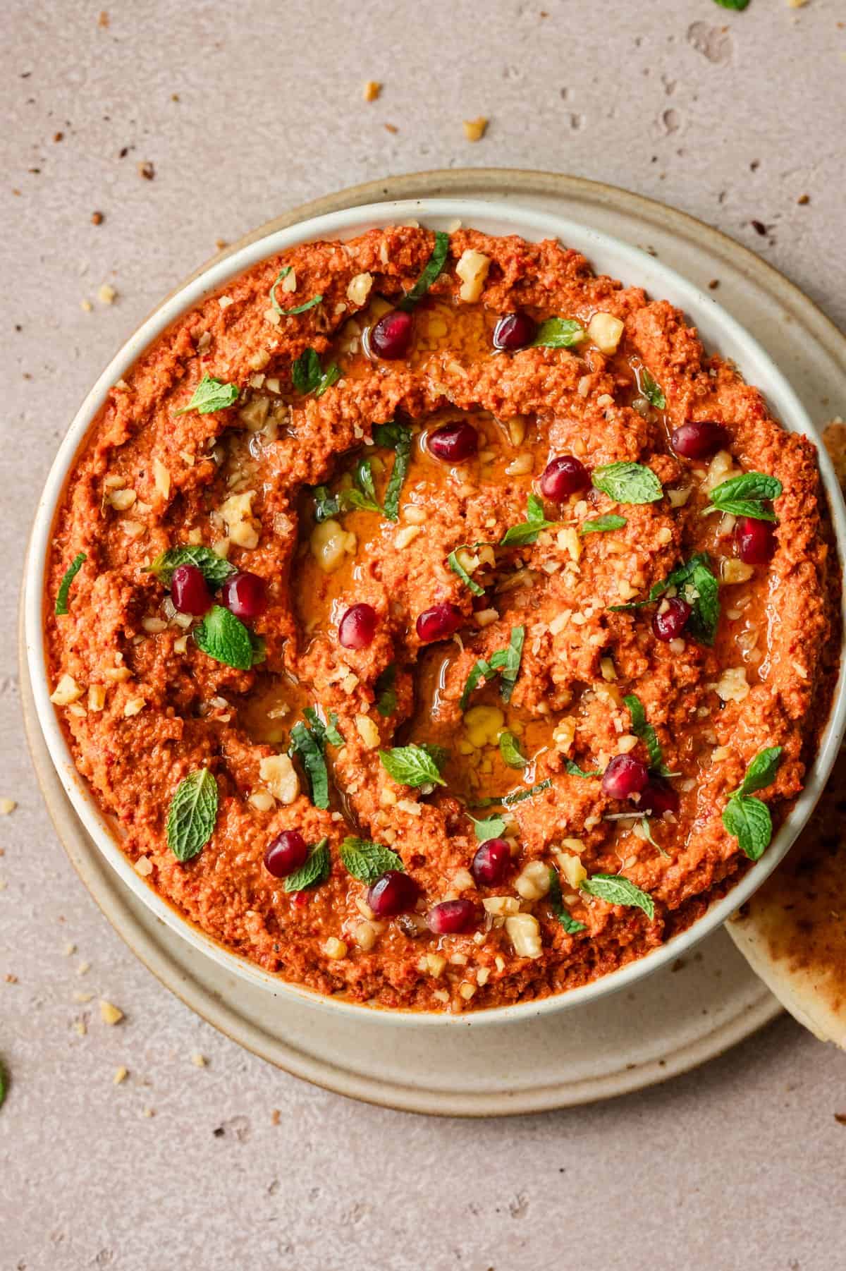 close up overhead shot of muhammara in a large shallow bowl.