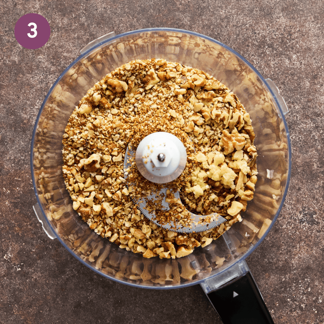 walnuts, bread crumbs and garlic in food processor before being blended.