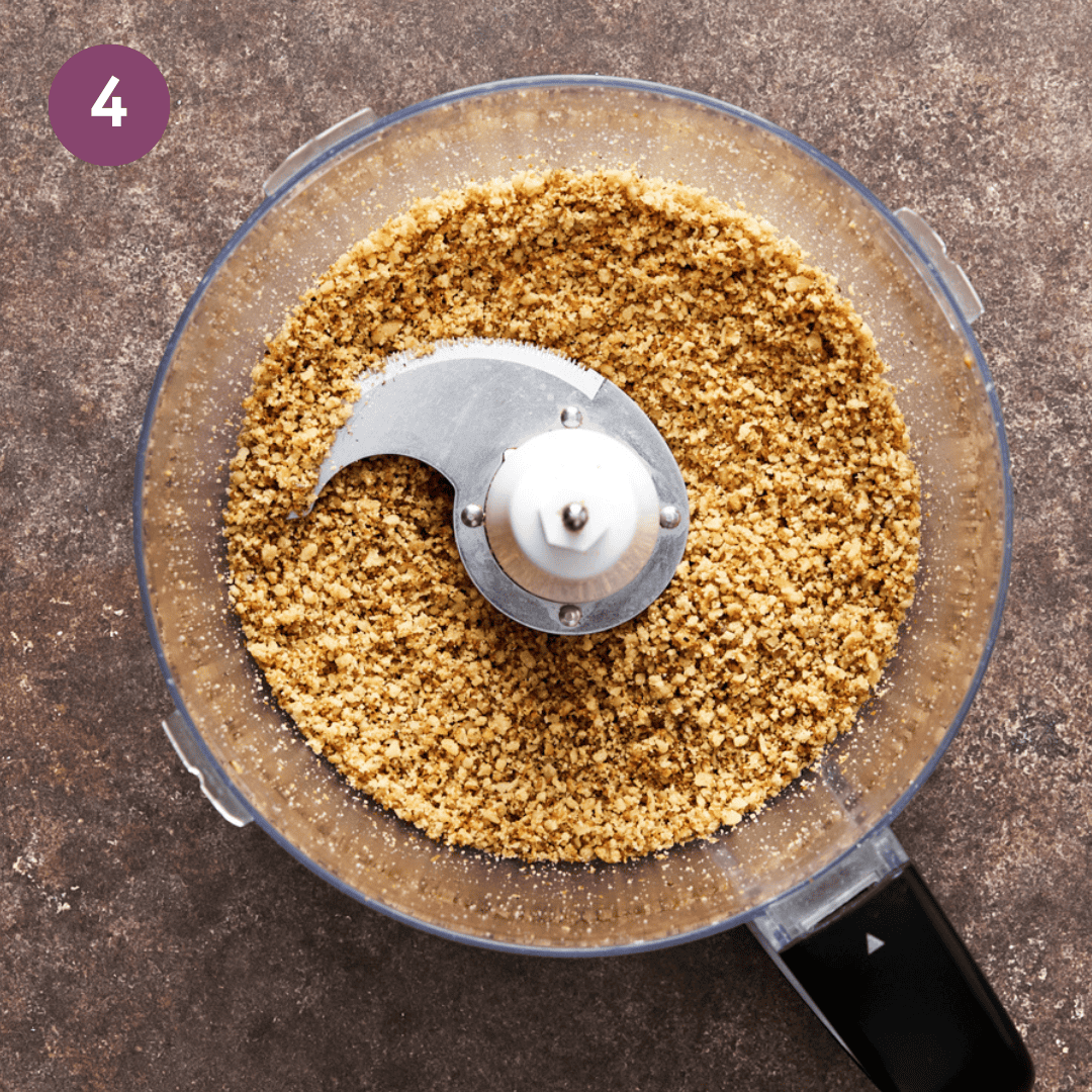 walnuts, bread crumbs and garlic in food processor after being blended into fine crumbs. 