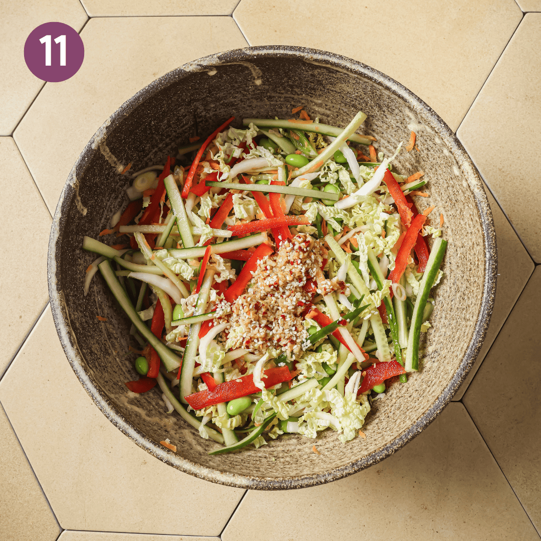 sauce mixture dumped over veggies in the bowl.