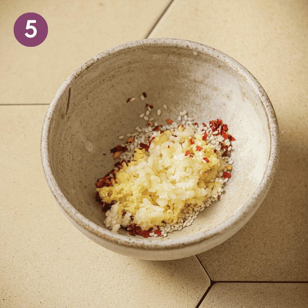 sesame seeds, chili flakes, ginger, and garlic in a small bowl.