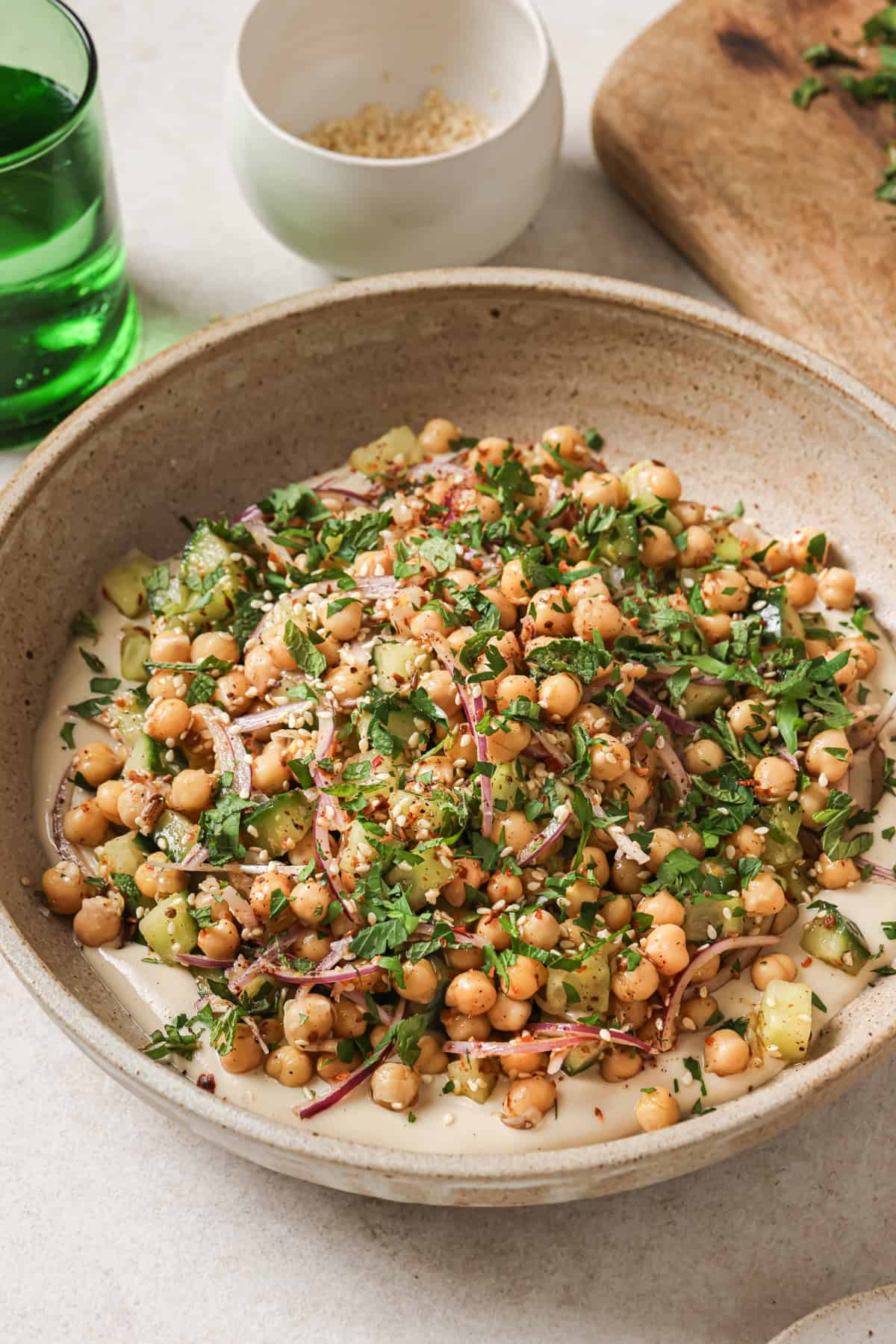Angled front view of chickpea salad with a soft, blurred background.