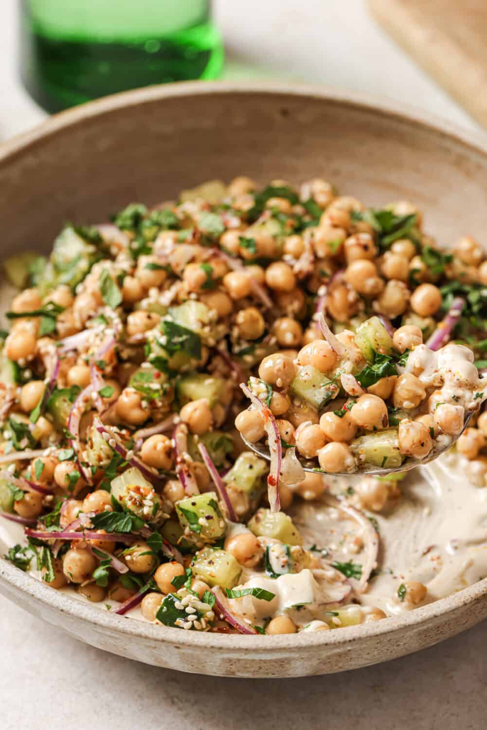 Close-up front angle of chickpea salad in a bowl.